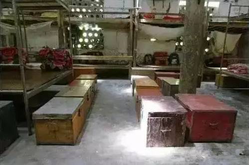 Wooden trunks on the floor of a door room.